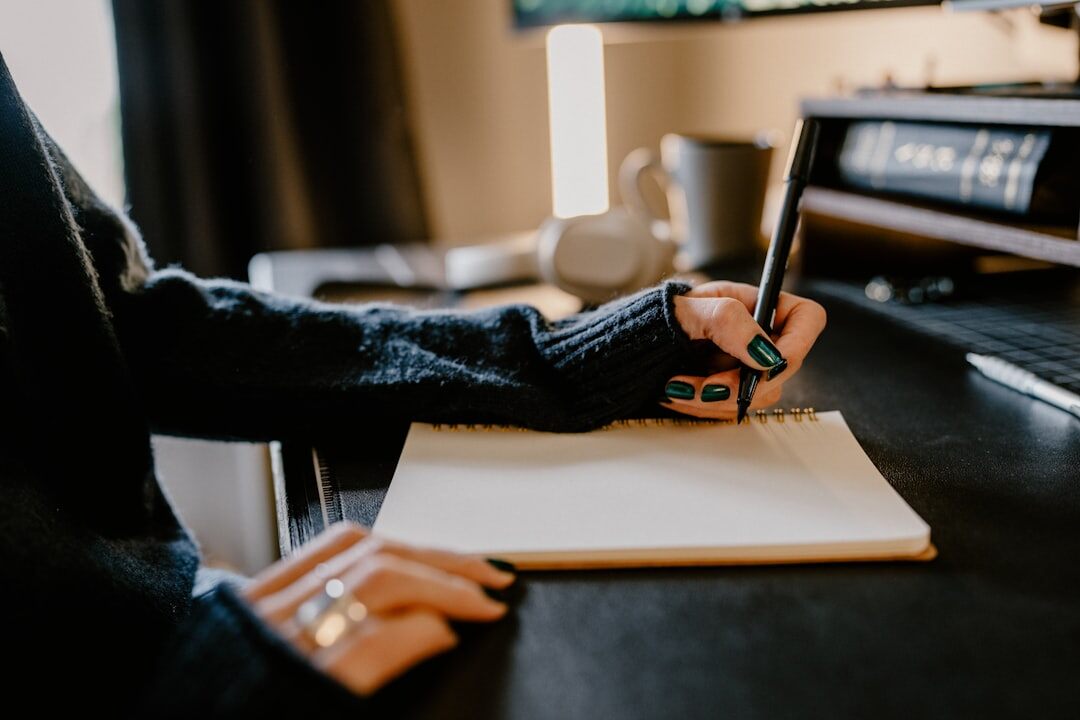 blogger writing at desk