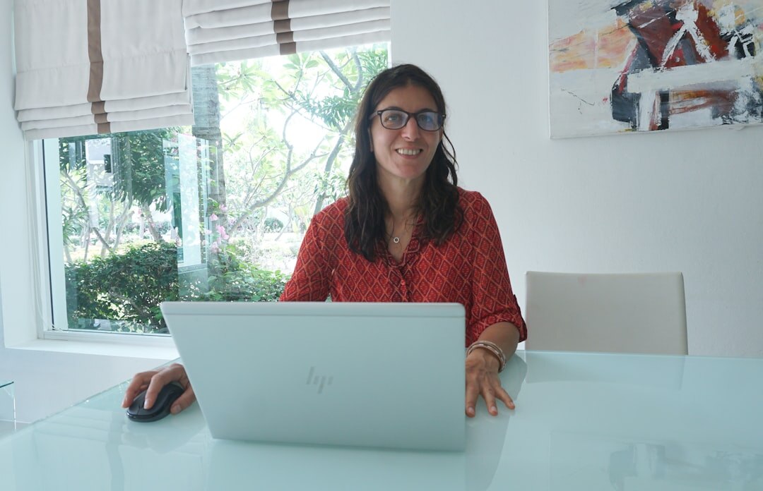blogger at desk with laptop