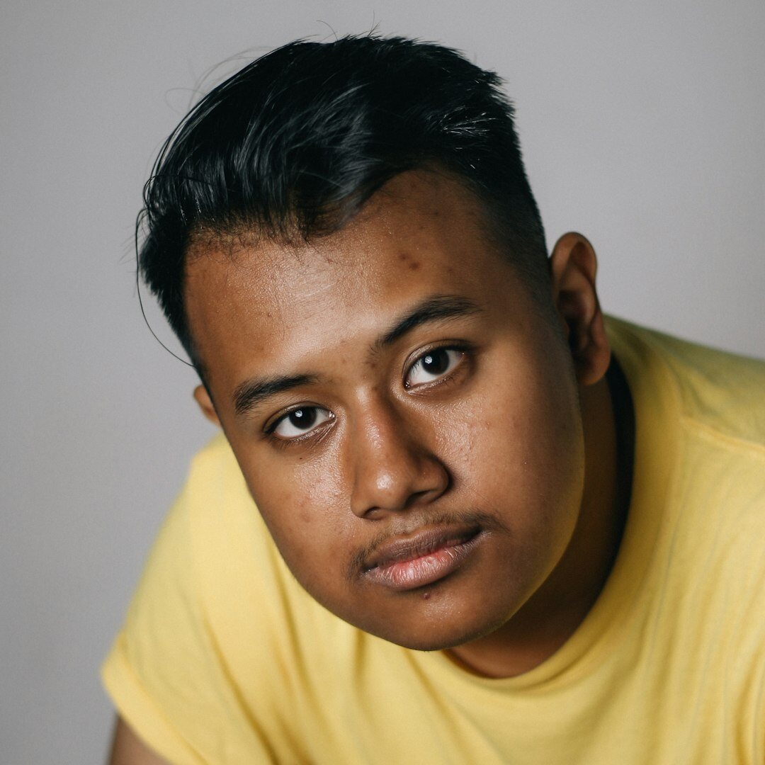 Portrait of a Malaysian Indian man, content writer, smiling